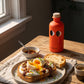Sourdough toast with Greek yogurt, soft-boiled eggs and chilli oil in warm morning light