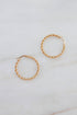 Claudette earrings — thin golden twisted hoops